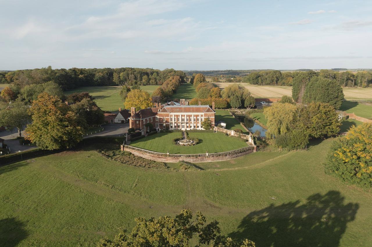 An aerial shot of stately home wedding venue Parklands, showing it amongst all the grounds 