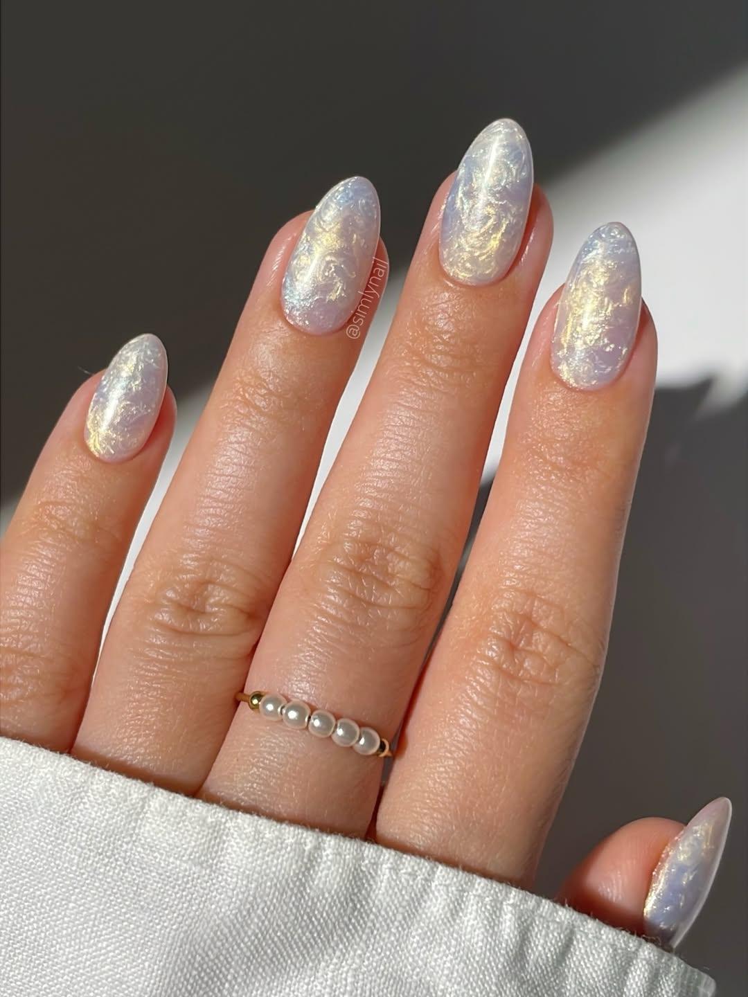 Blue and yellow shimmer swirl nails