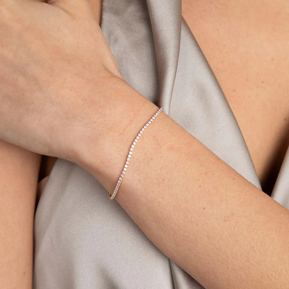 15.  Tennis Chain Bracelet in Gold – Astrid & Miyu