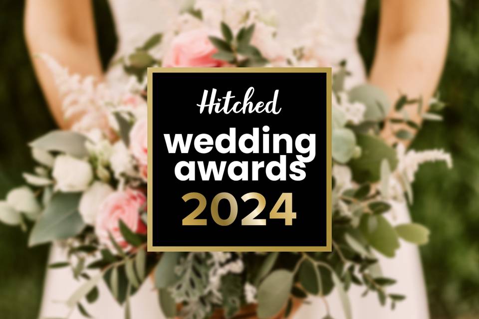 Hitched Wedding Awards 2024 logo overlaid on a picture of a bride holding a bouquet of flowers