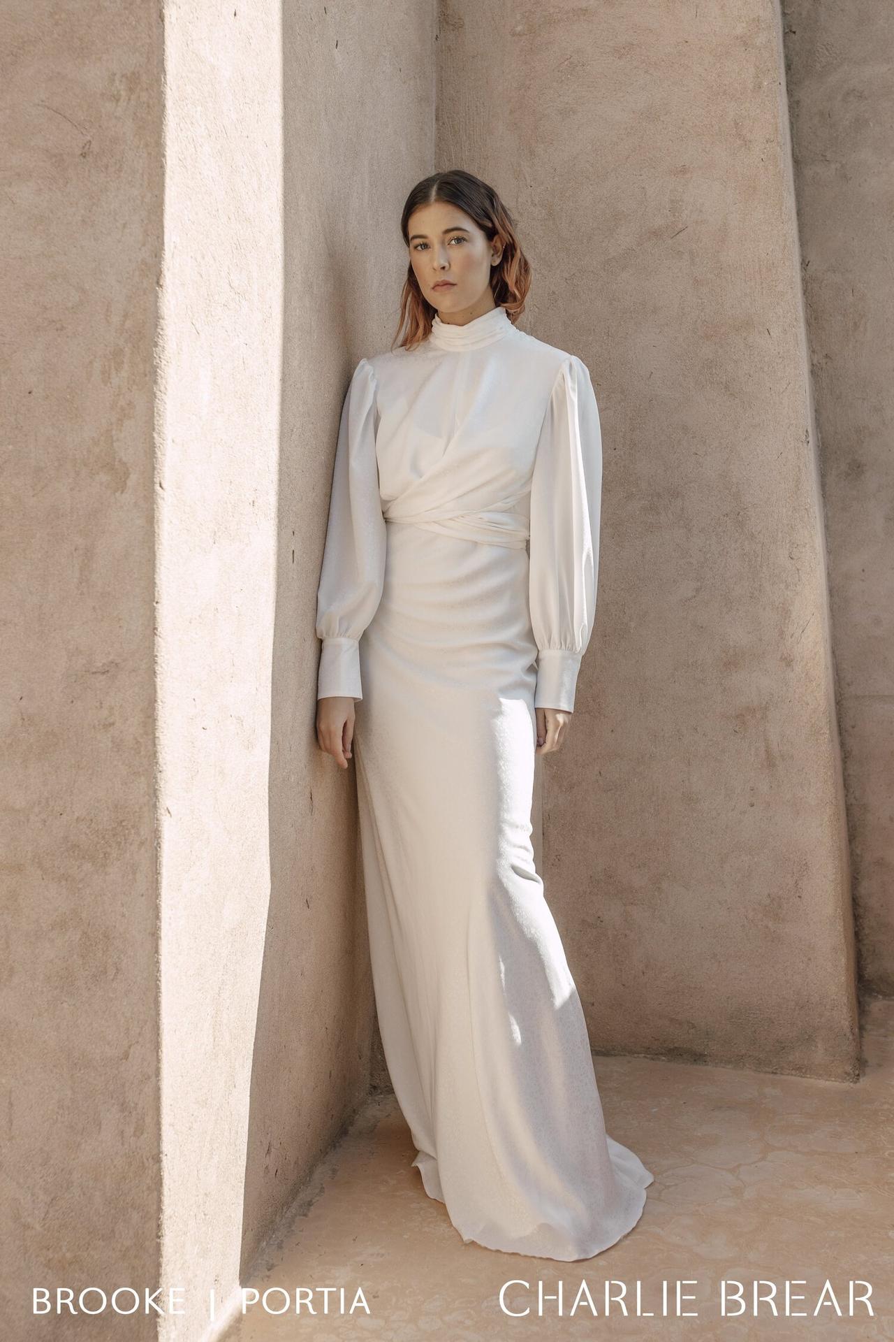 Image of a model wearing a high-neck wedding dress with long sleeves