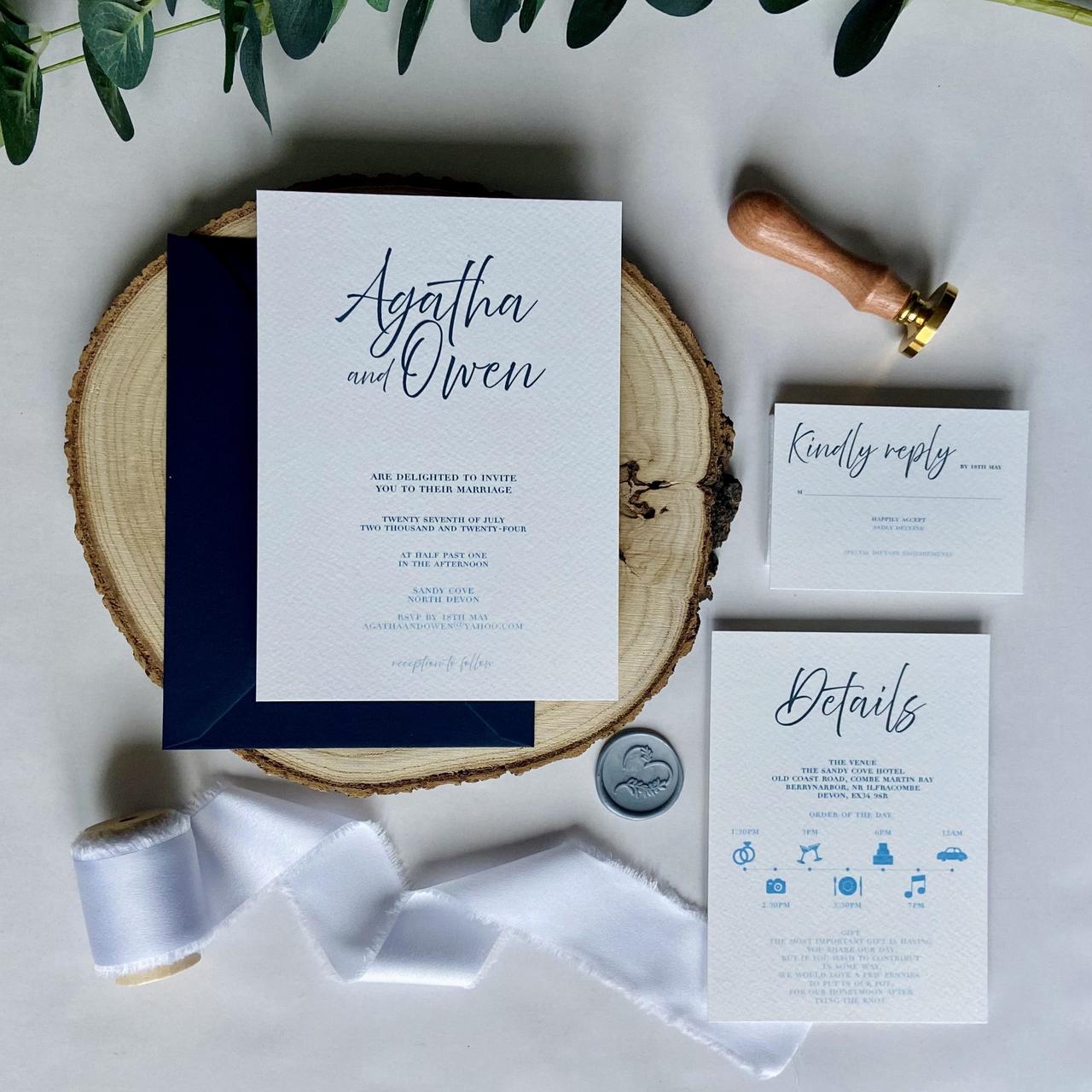 Classic style wedding invitation with dark blue calligraphy