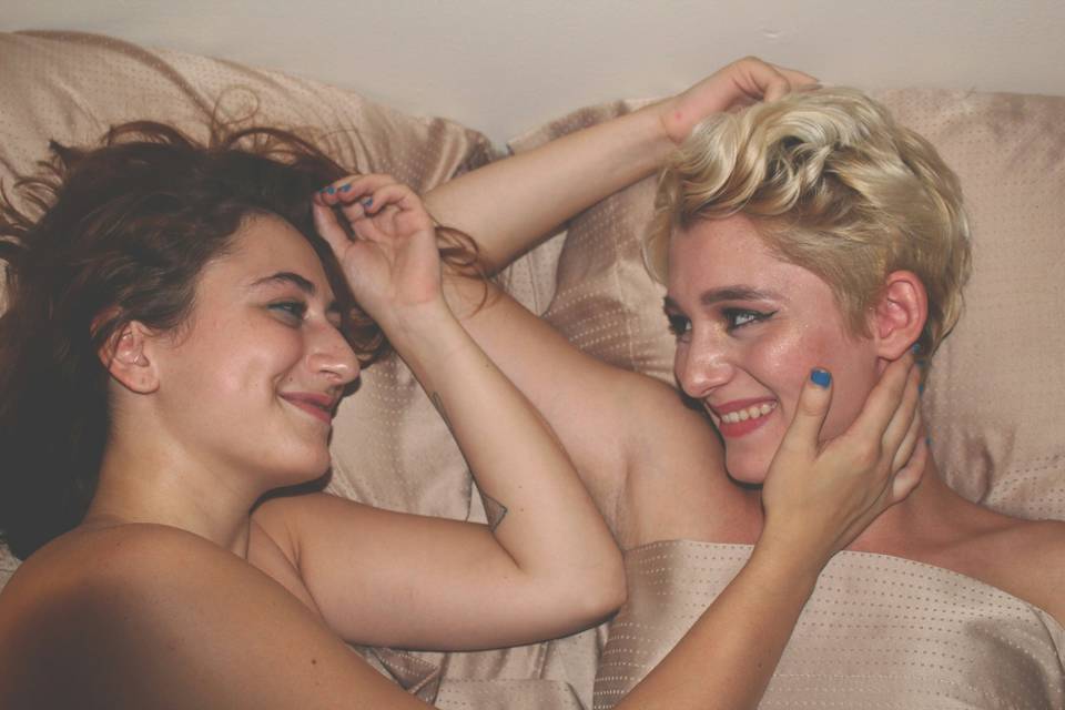 two women embracing in the bedroom