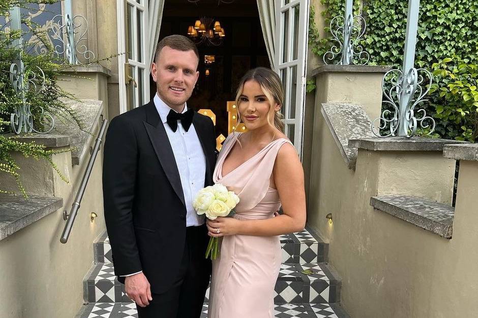 Georgia Kousoulou and Tommy Mallet dressed smartly at a friend's wedding where Georgia is a bridesmaid