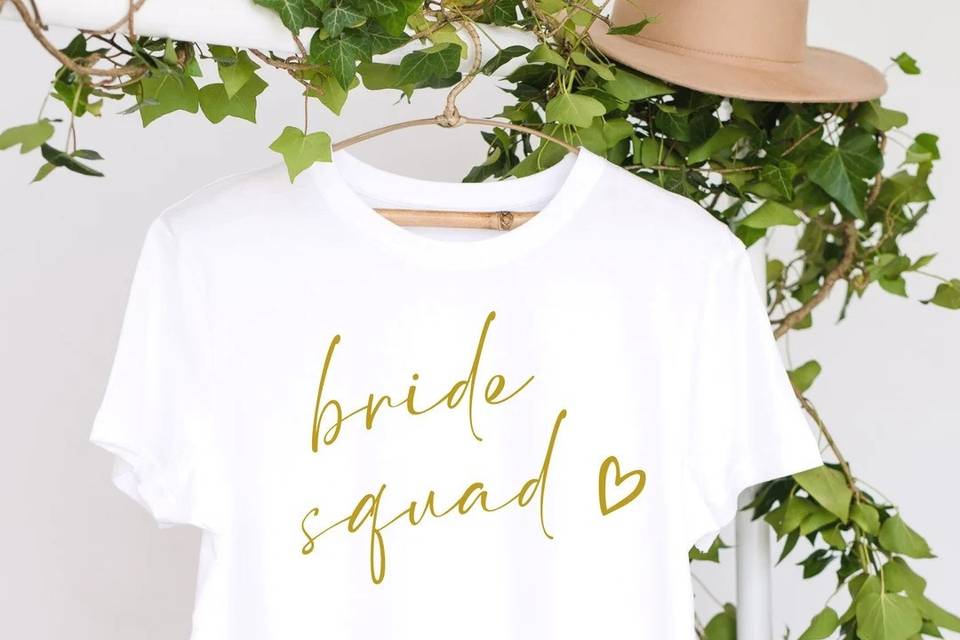 White bride squad t-shirt with gold writing