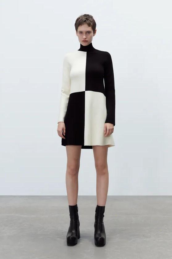 Short knit colour block dress in black and white with long sleeves and turtleneck