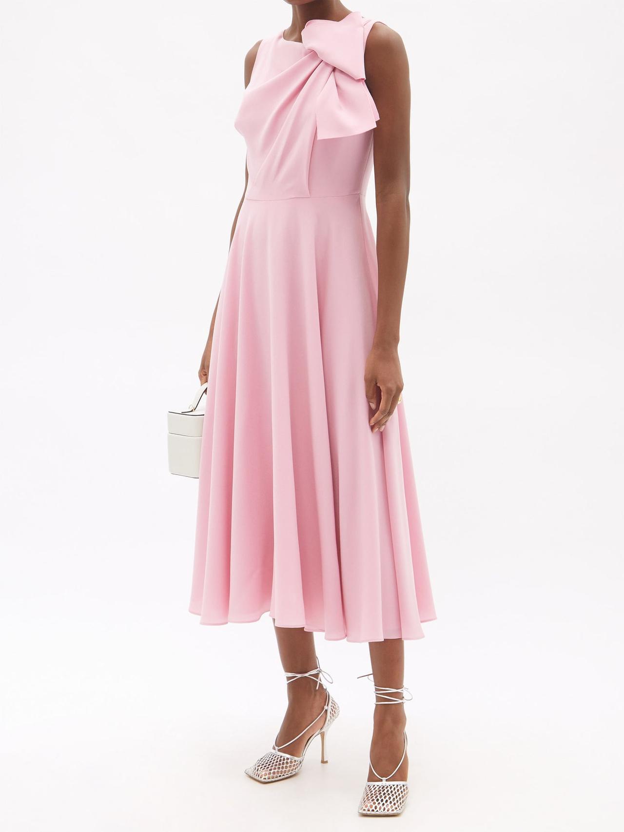 Model wearing a pink bow midi dress