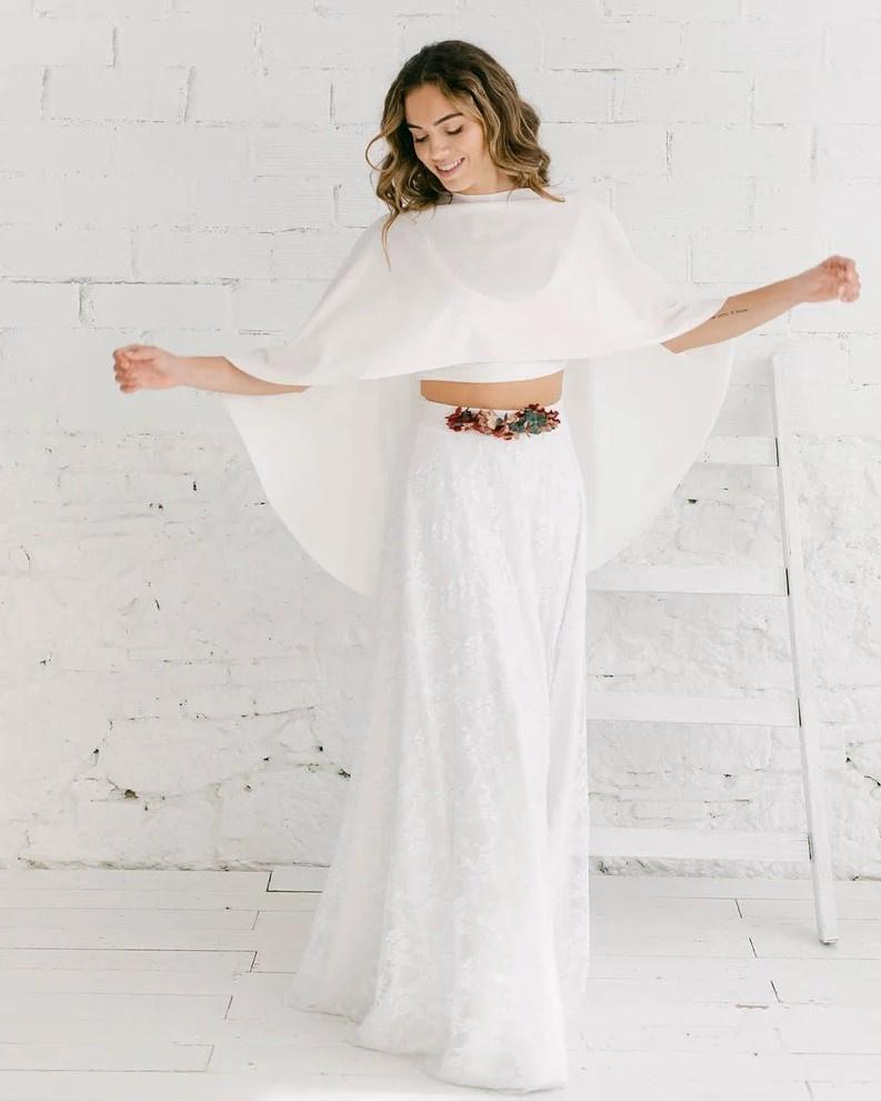 Model wearing a plain white bridal cape
