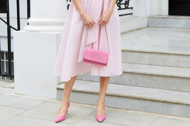 Matching pink suede effect mother of the bride bag with a chain handle and matching pink pointed court shoes