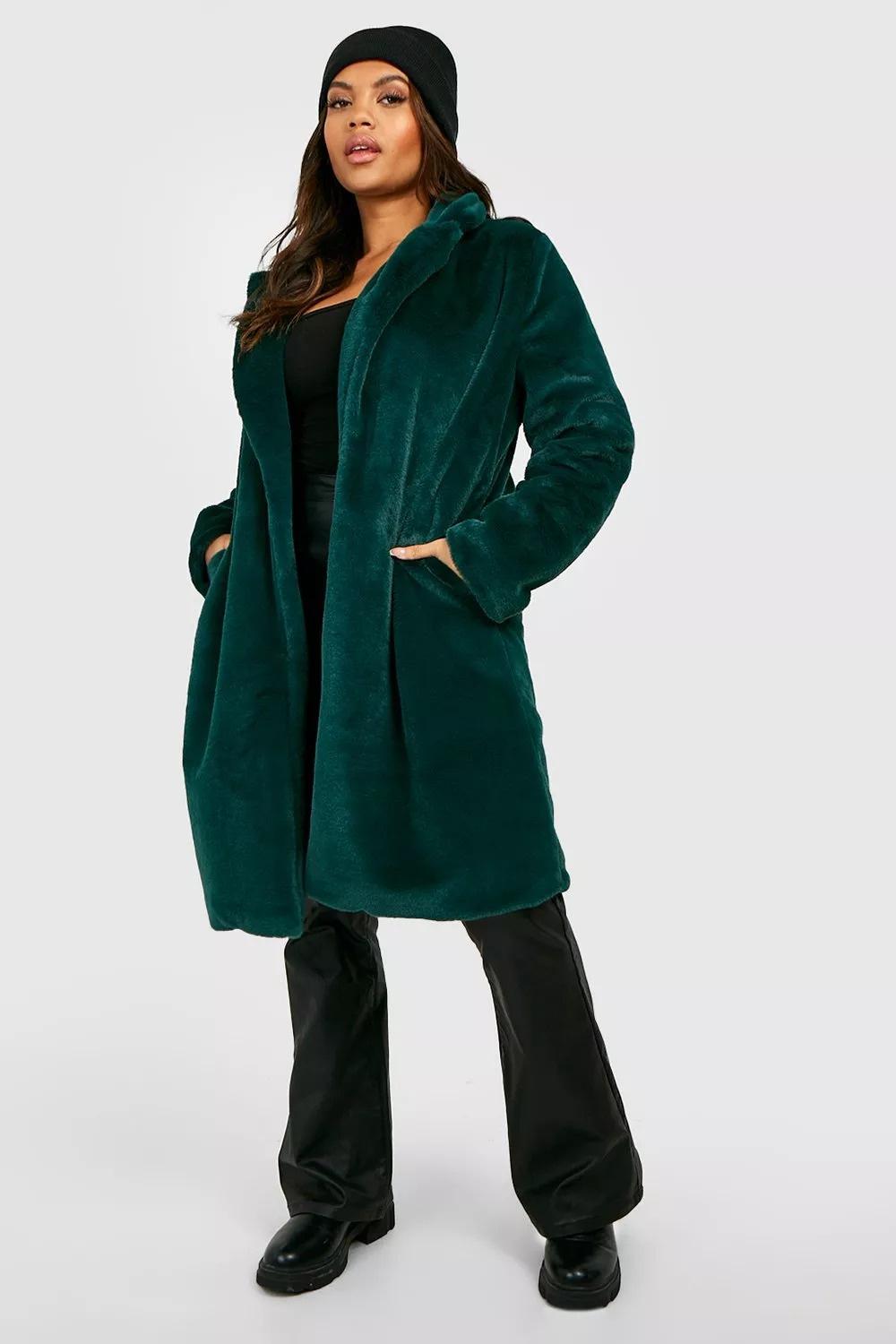 Model wearing a green faux fur coat