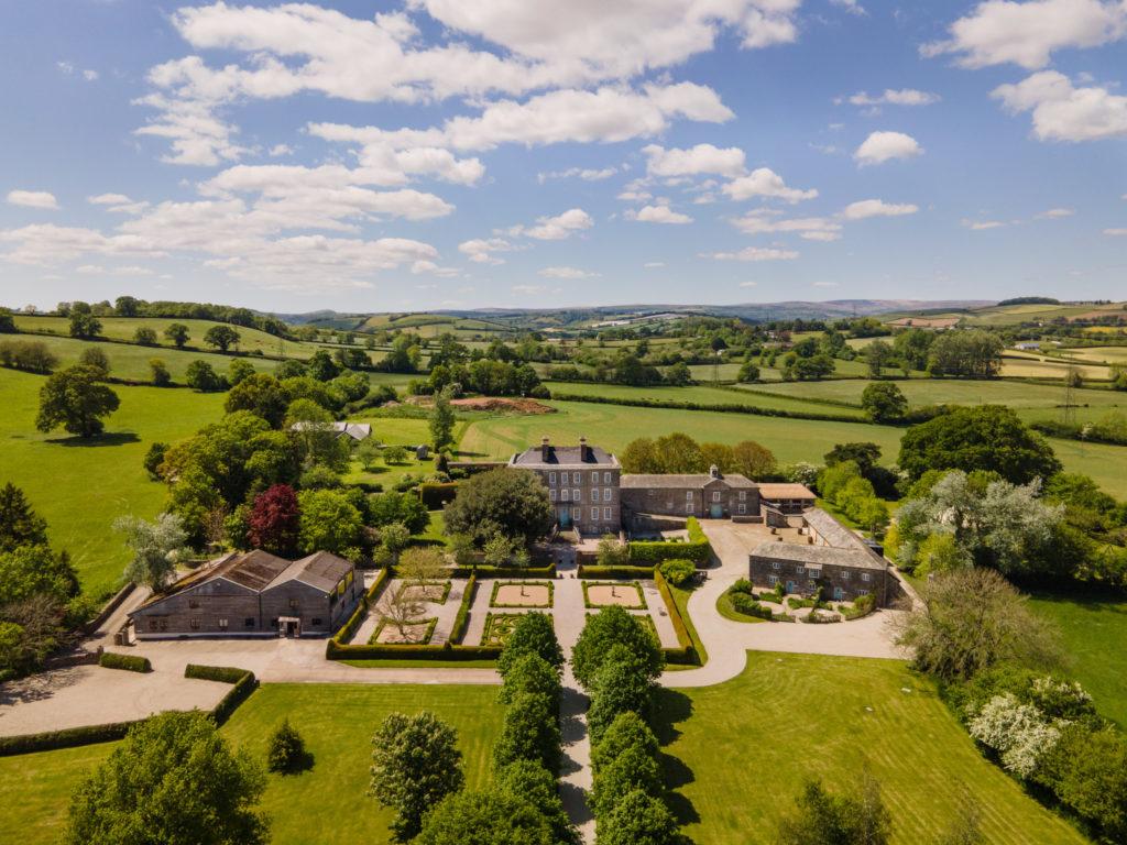 An aeriel view of Kingston Estate with rolling fields and manicured gardens