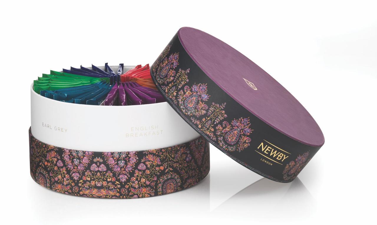 A round floral box featuring an assortment of tea bags.