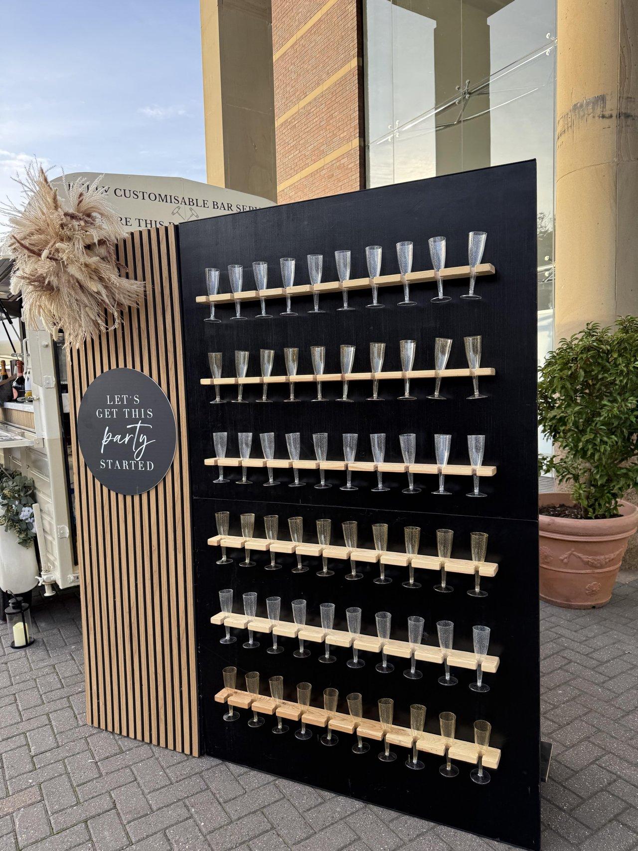 prosecco wall by the roaming bar staff