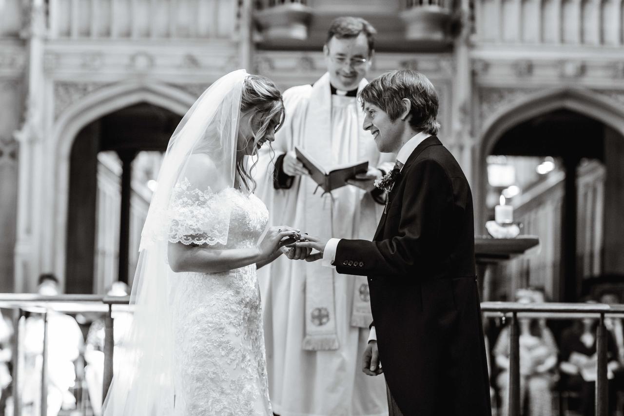 A bride and groom exchange rings
