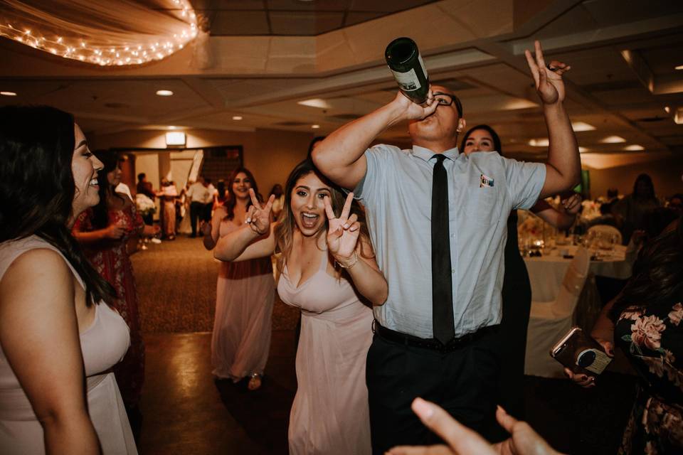 wedding guests drinking on dancefloor