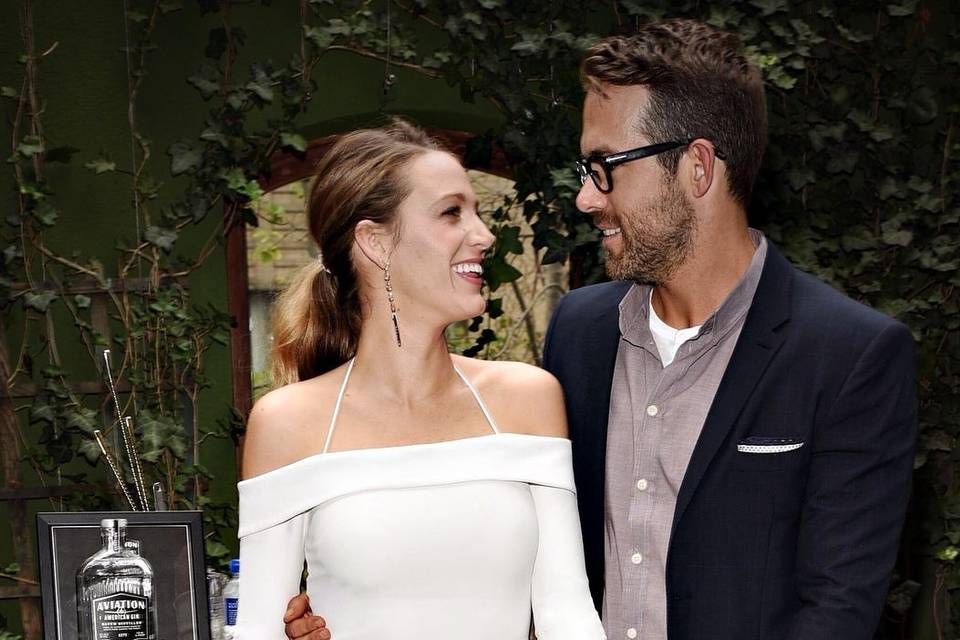 Celebrties who met on set and married love interests - Blake Lively and Ryan Reynolds smiling at each other