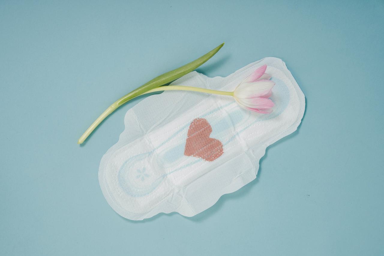 Sanitary towel with a heart marked out on it in red