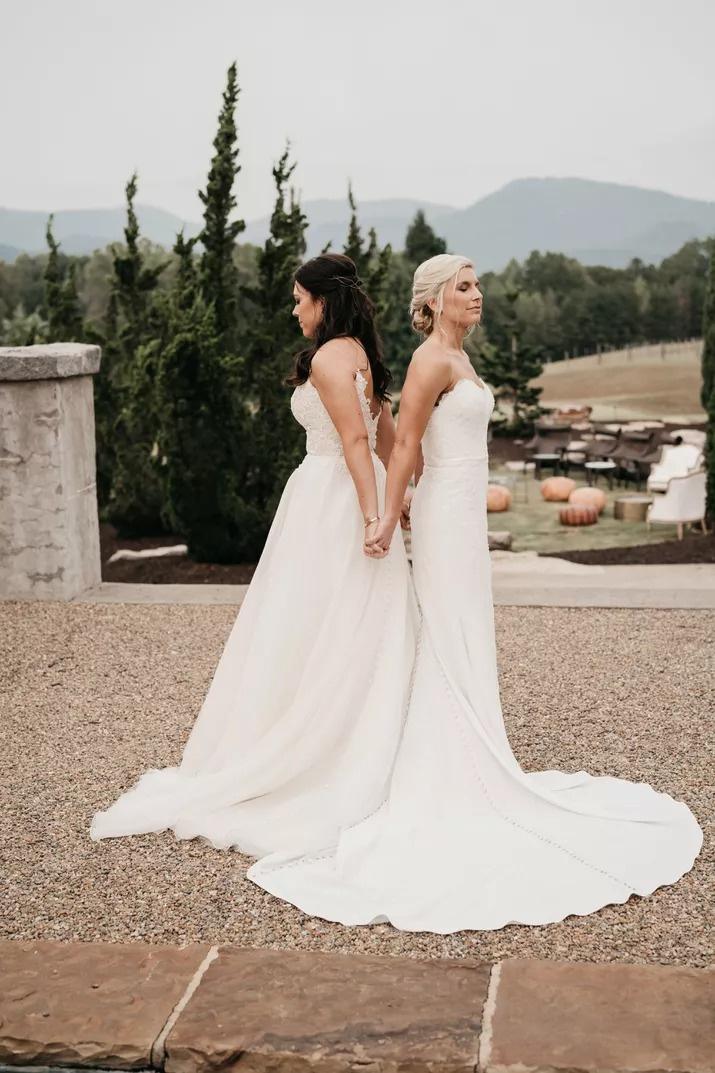 Bride and bride back to back during a wedding first look