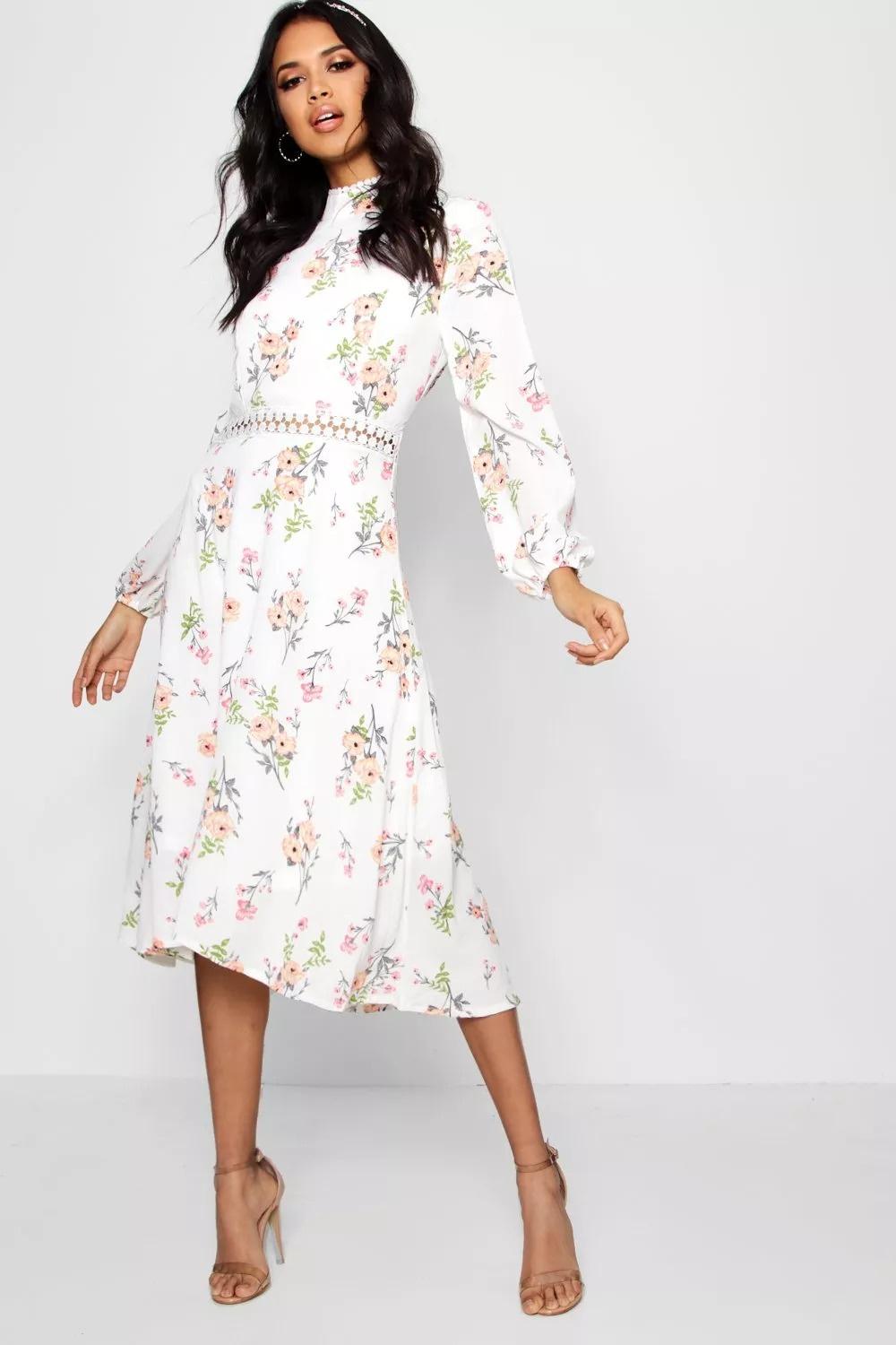 Model wearing a floral long sleeved casual wedding dress