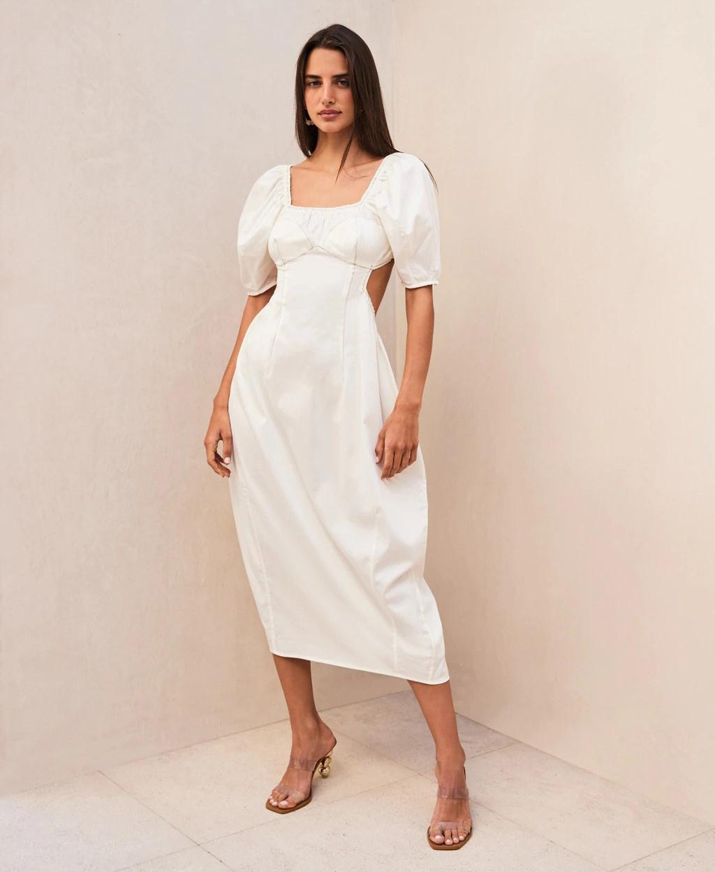 Model wearing a linen cut out puff sleeve wedding dress