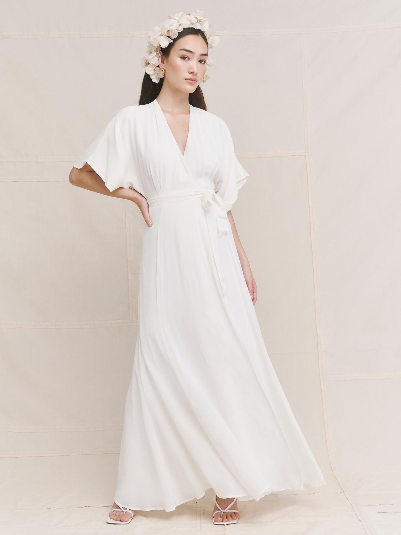 Model wearing a draping wedding dress
