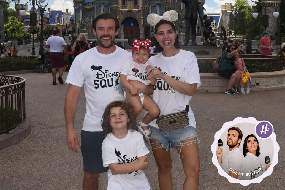 Cara Delahoyde, Nathan Massey and their two children Delilah and Fred posing in front of the Magic Castle in Disney's Magic Kingdom theme park wearing matching Disney t-shirts