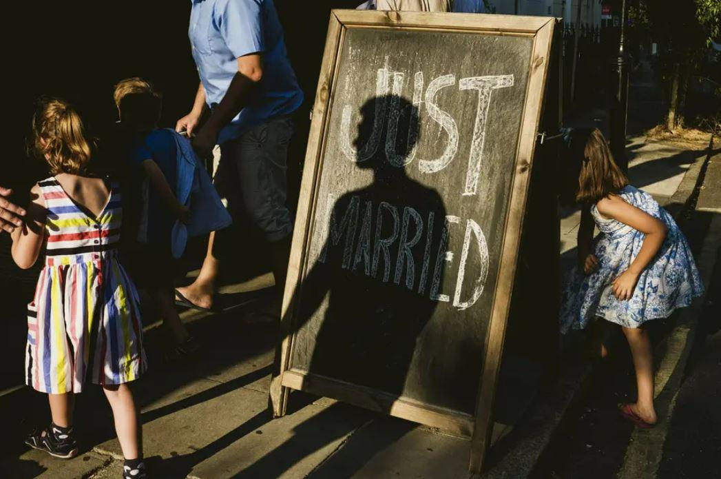 just married sign with children running around