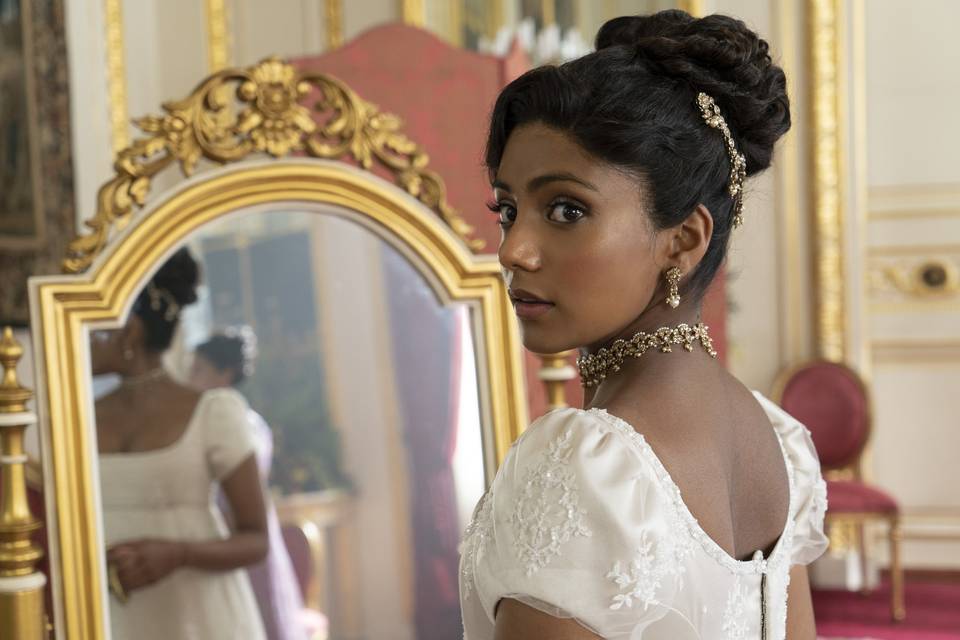 Actress Charithra Chandran portraying Edwina Sharma in a wedding dress on Bridgerton