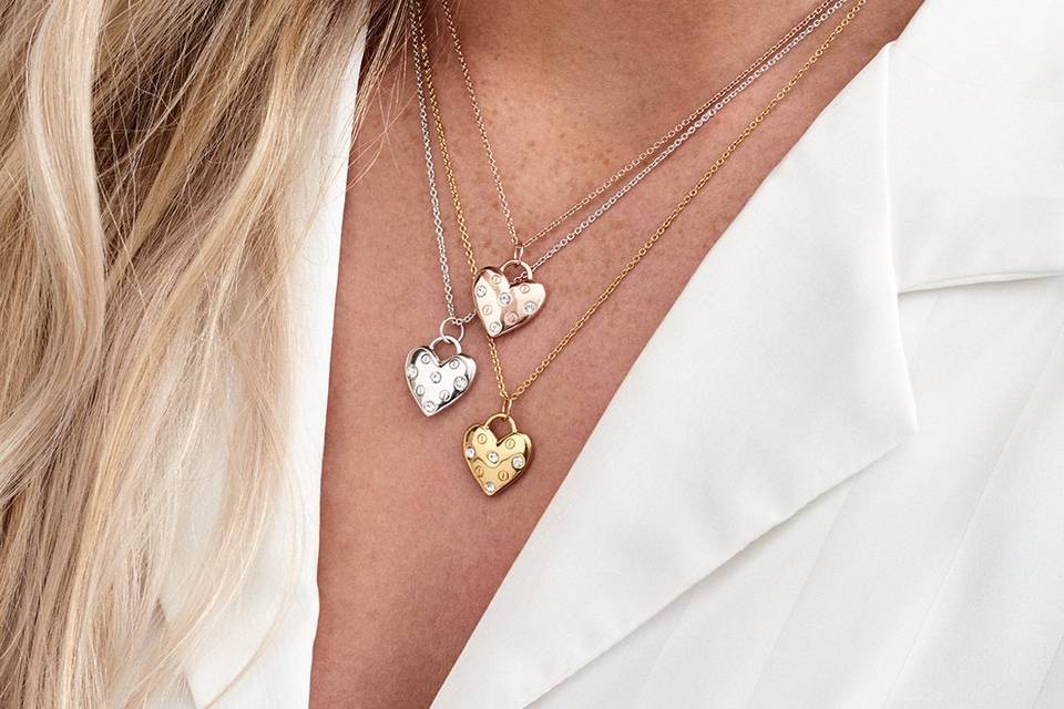 Model wearing Olivia Burton gold heart necklace 