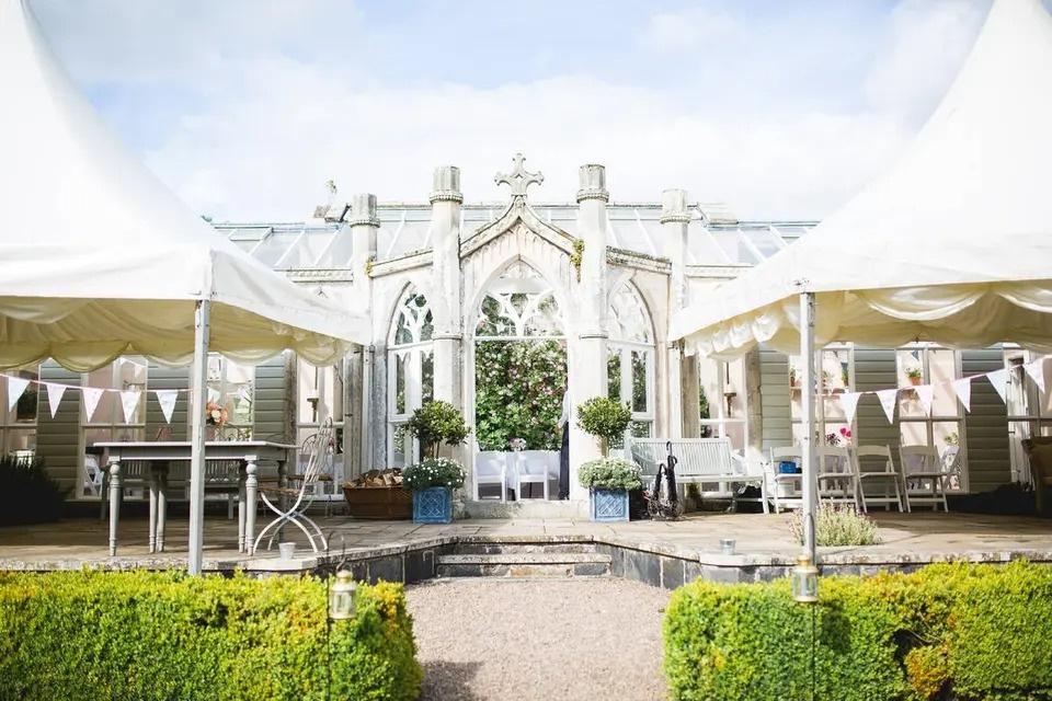Castle wedding venue with bunting and marquees