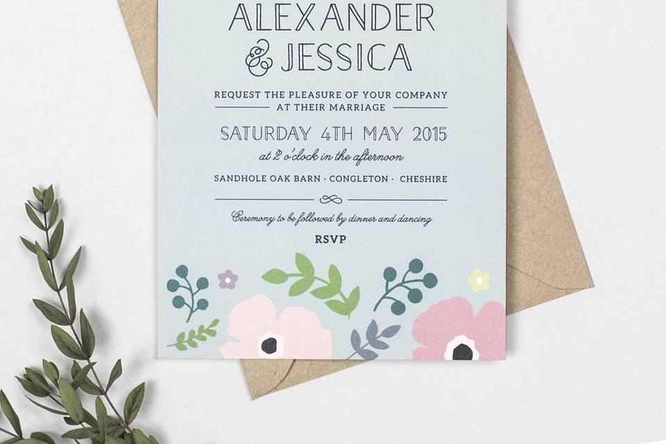 Light blue invites with stylized pink poppies and green and blue foliage with modern and cursive text