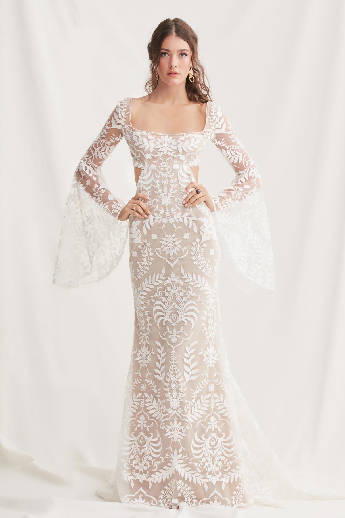 Model wearing an embroidered lace boho square neck wedding dress