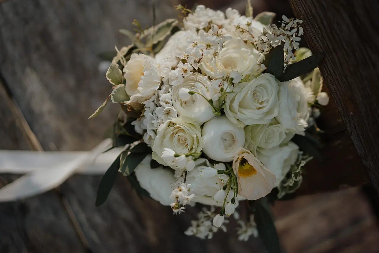 All white wedding bouquet with roses