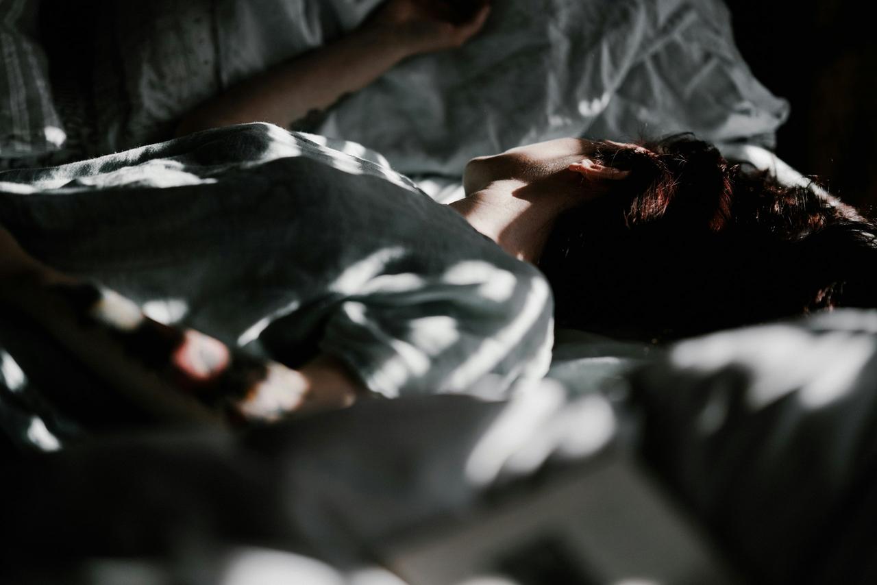 woman sleeping on a bed