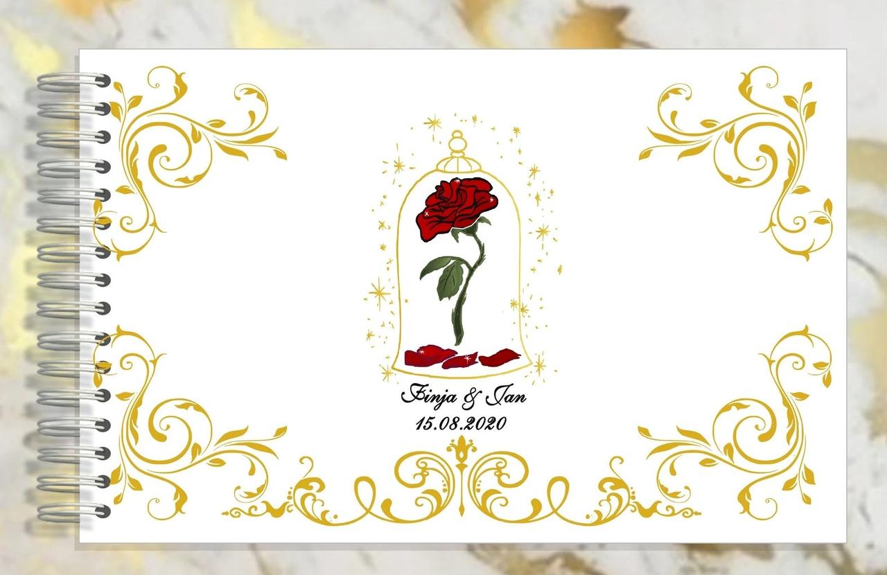 Wedding guest book with a red rose and gold detailing 