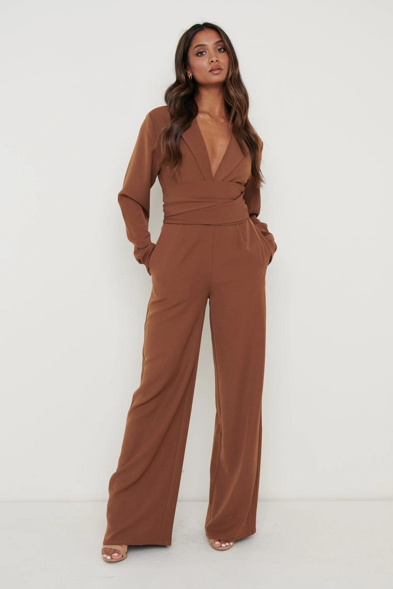 Model wearing a brown jumpsuit