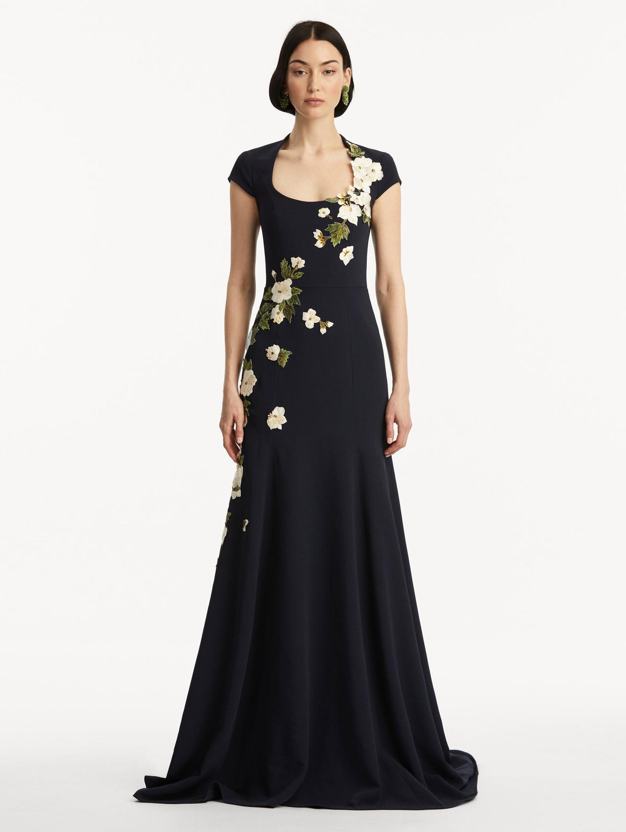 A scoop neck dress in a navy blue with cherry blossom applique