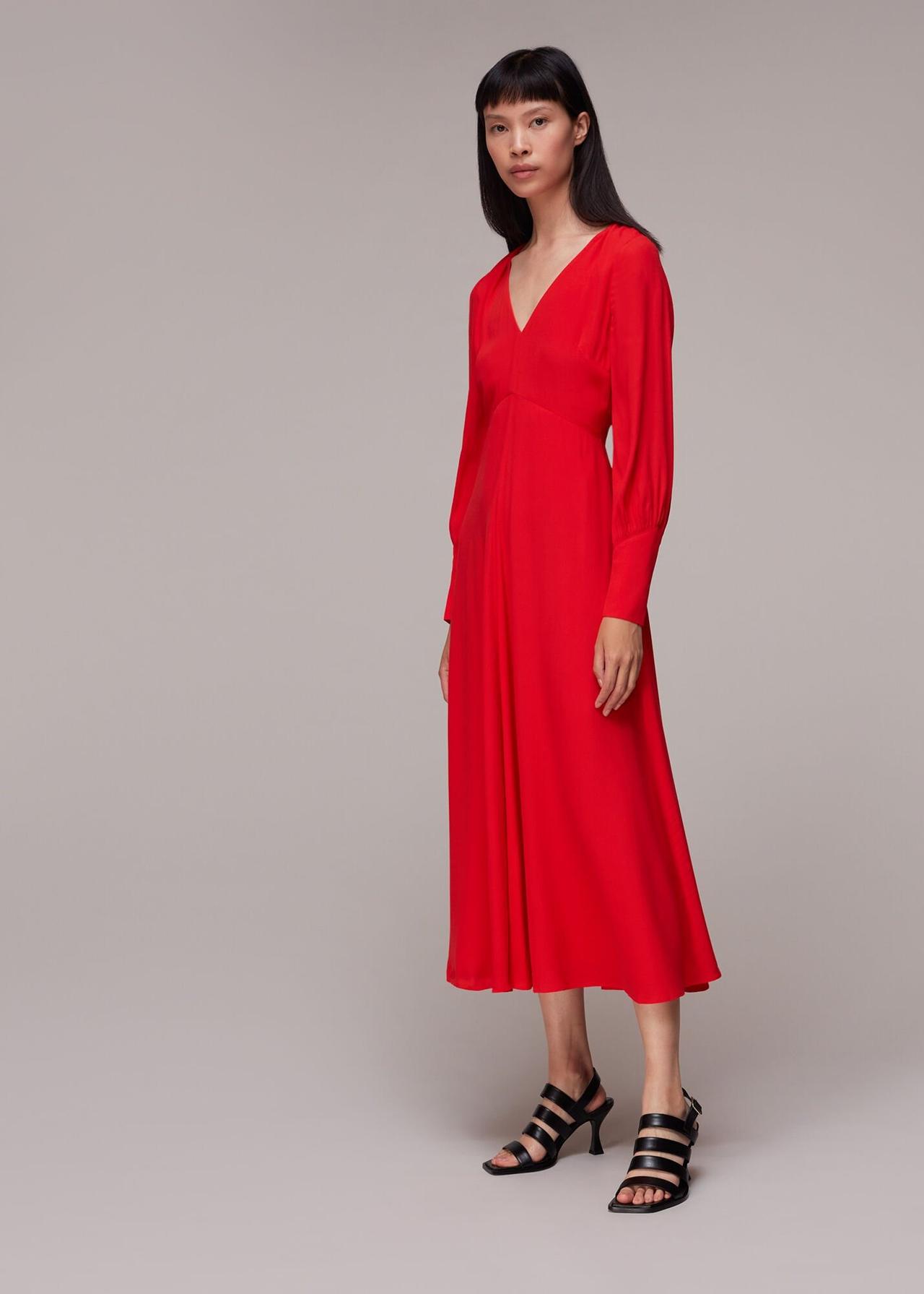 Model wearing a long sleeved red bridesmaid dress