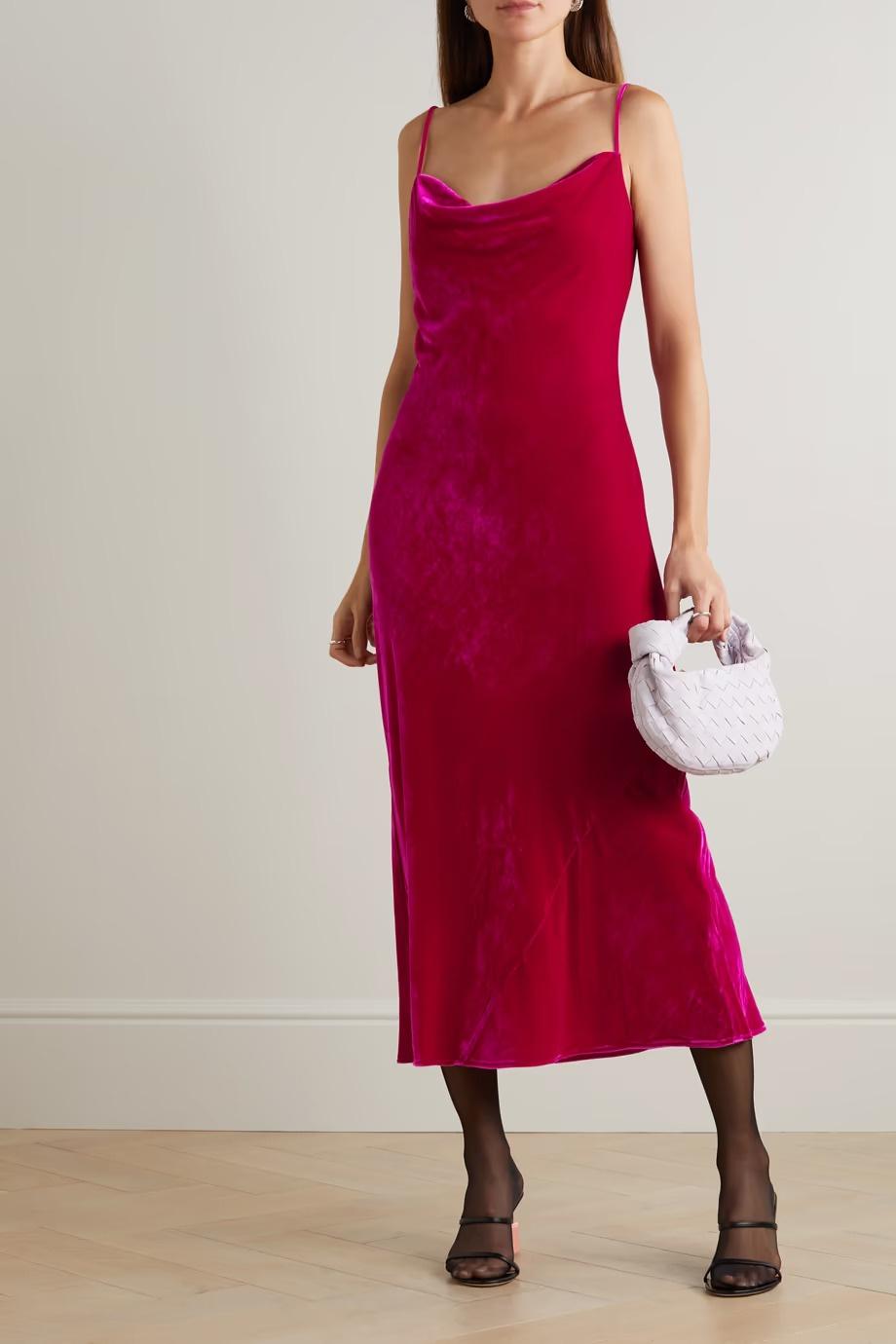 Model wearing a strappy pink velvet bridesmaid dress