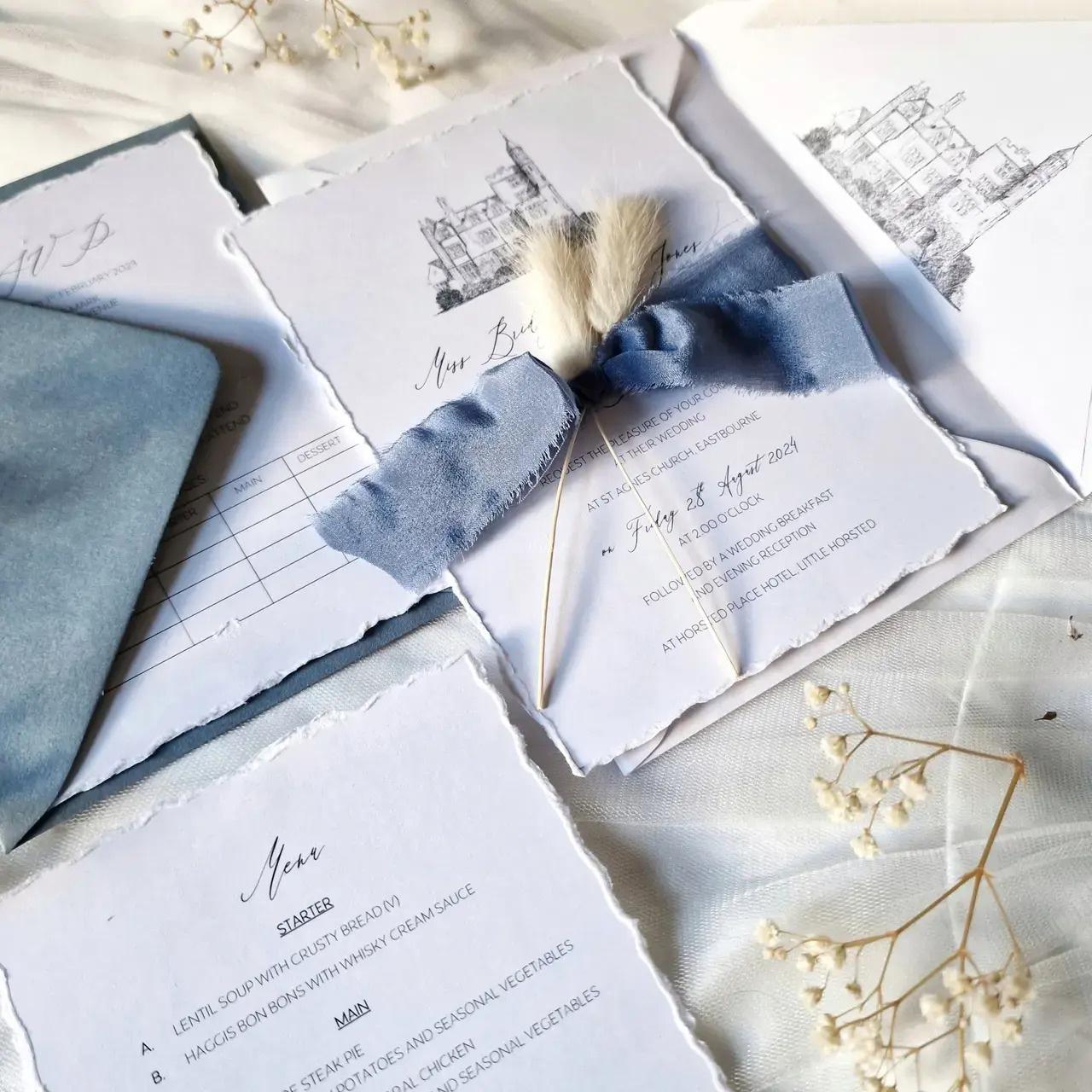 wedding invite with blue ribbon