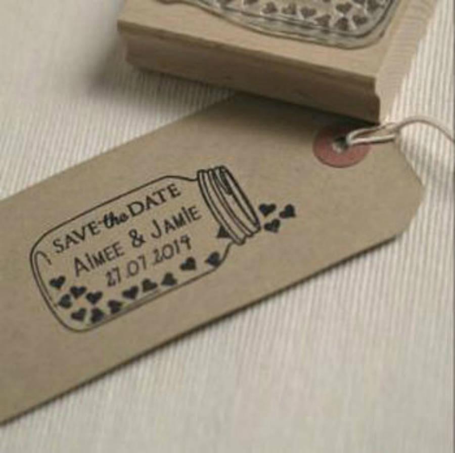 Brown label with mason jar full of hearts with save the date detail