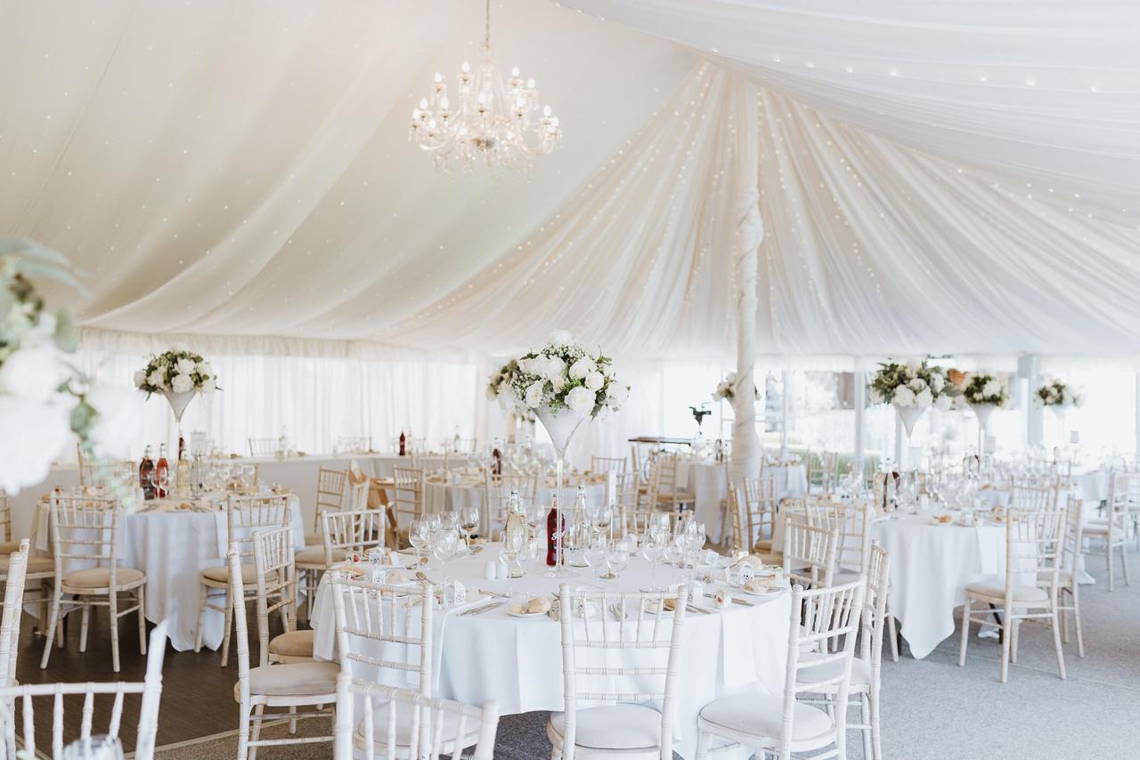 Chic and sophisticated wedding breakfast in white marquee