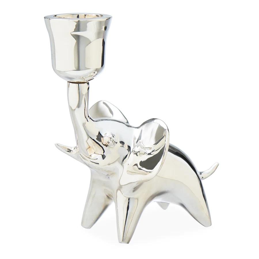 A silver elephant shaped candle holder