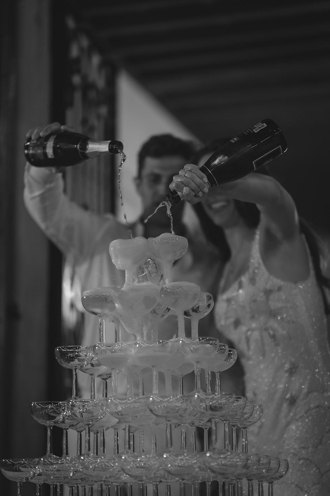 Josie and Cameron pouring their champagne tower