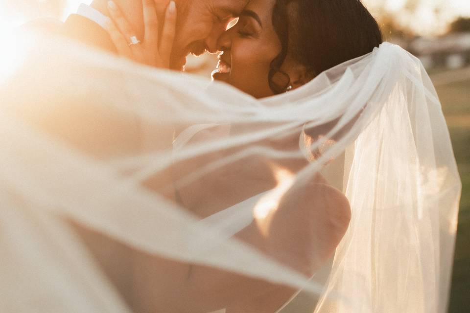 A couple dancing in the sunset outside to Christian wedding songs