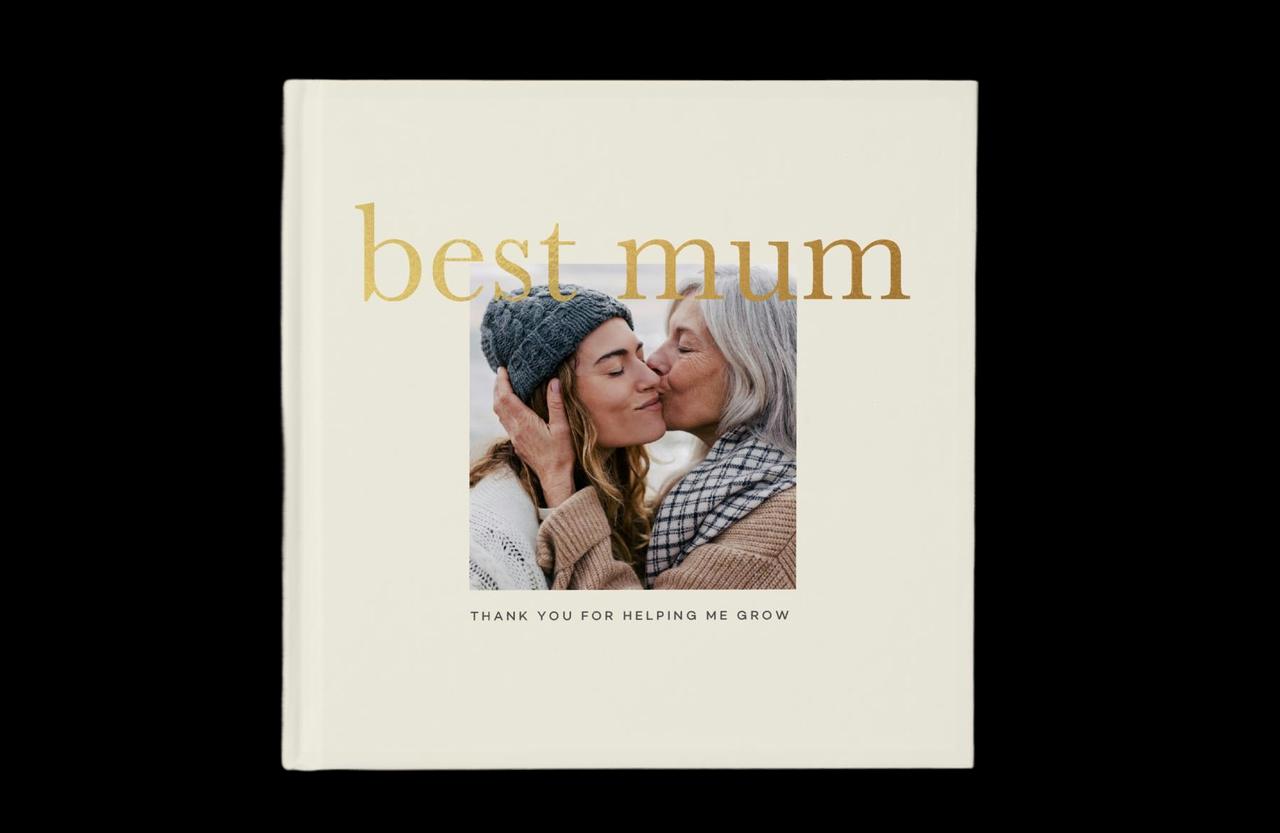A photo book that reads 'Best Mum' with a photo of a daughter hugging her mother, a great mother of the bride photo gift.