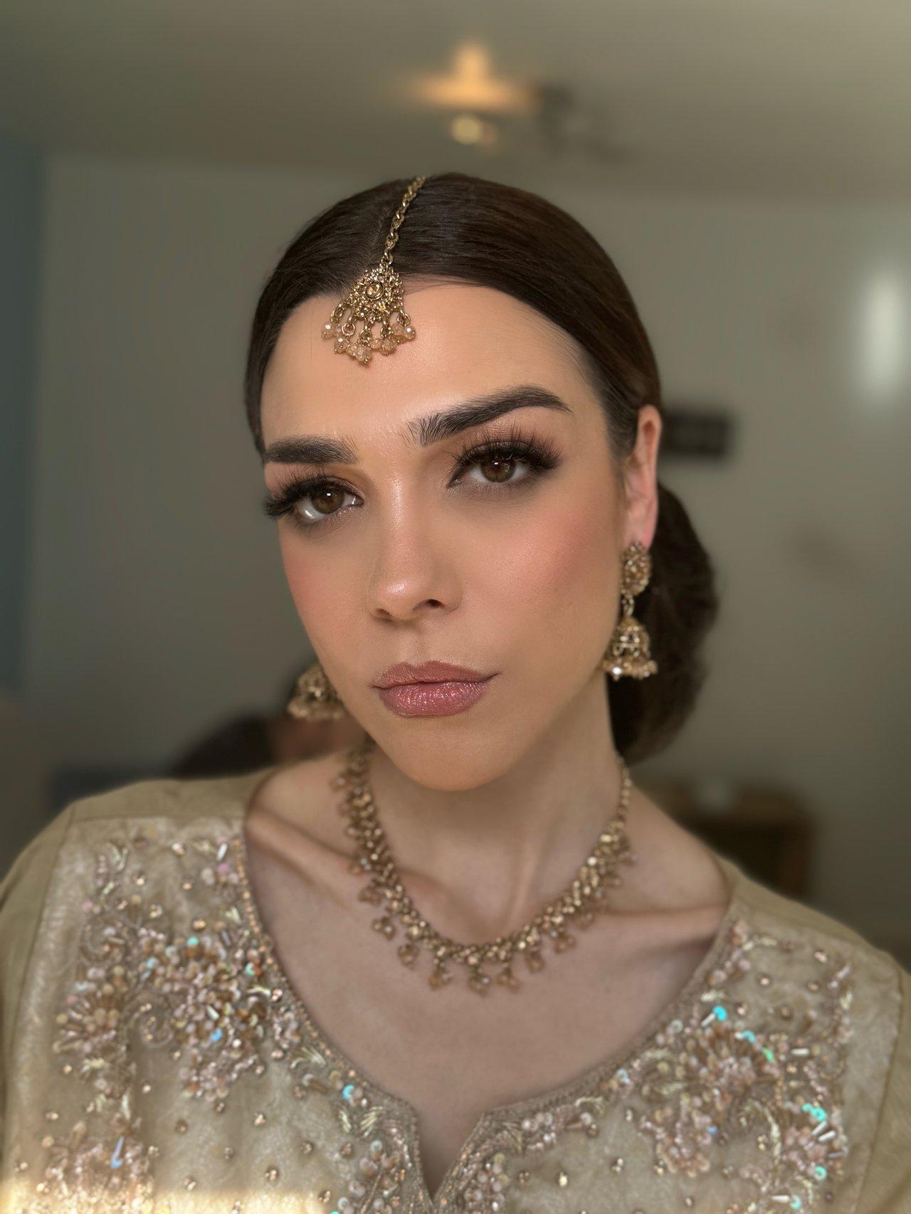 Indian bride with gold dress and gold jewellery