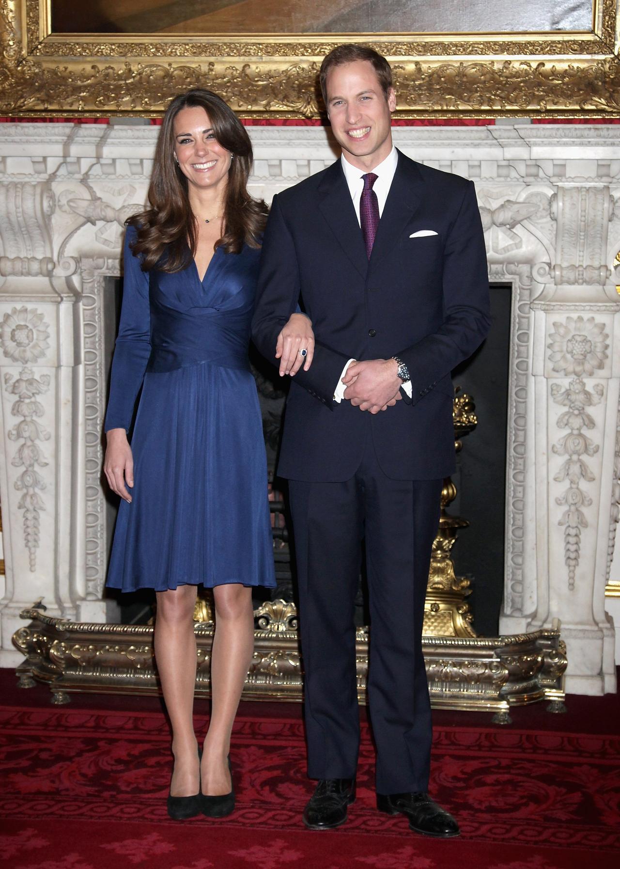 Kate Middleton and Prince William stand together to announce their engagement 
