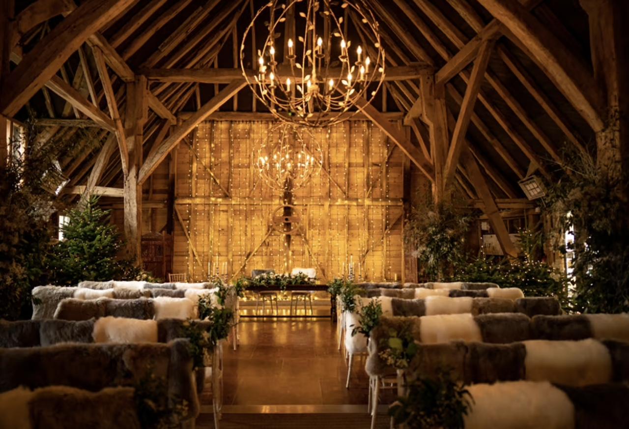 fur throws on stools in Odo's Barn decorated for a winter wedding