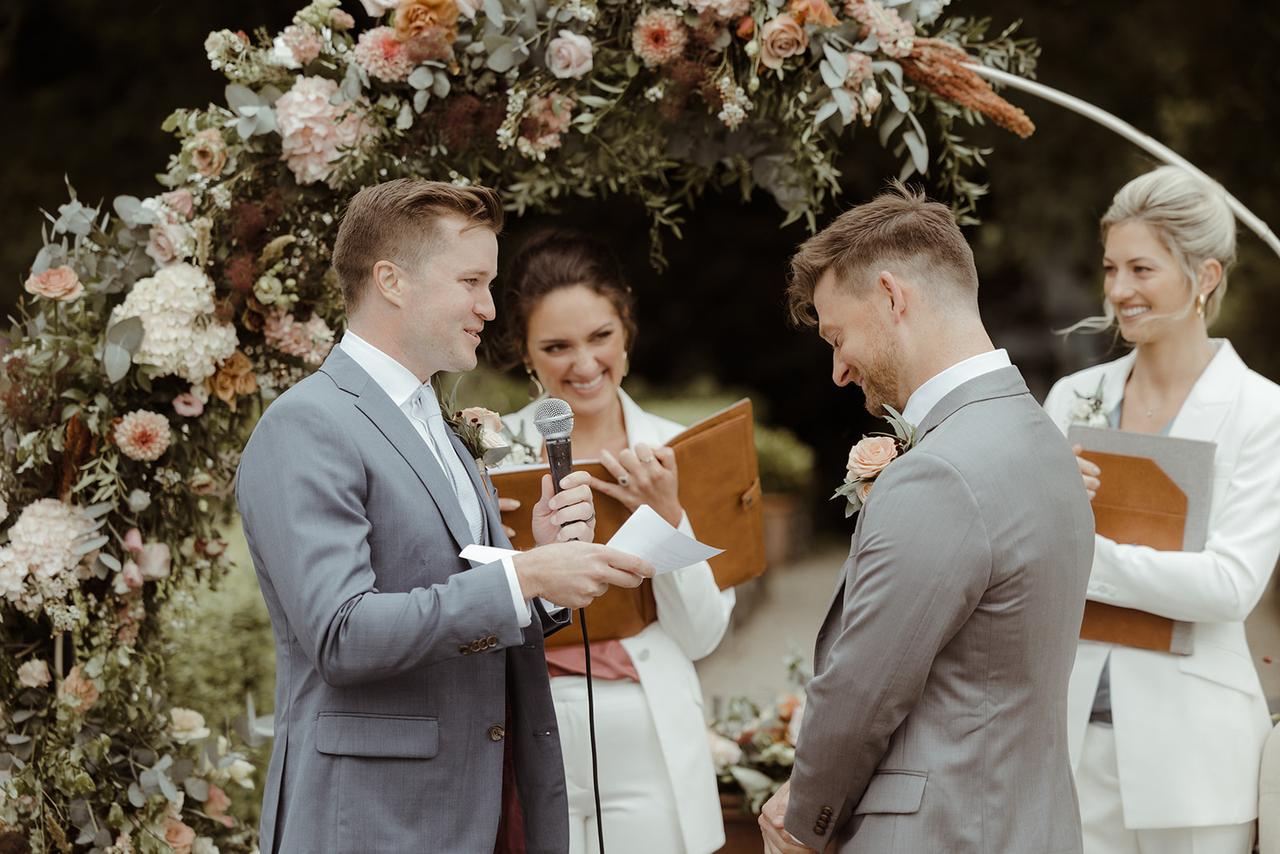 The grooms exchange their vows